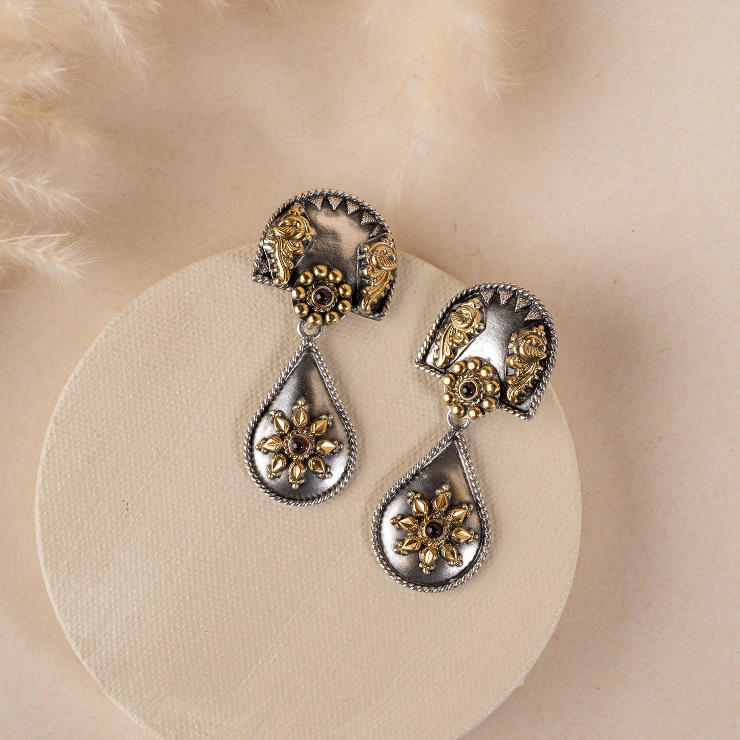 Stunning silver chandbali earrings with intricate detailing, embodying traditional elegance and grace.