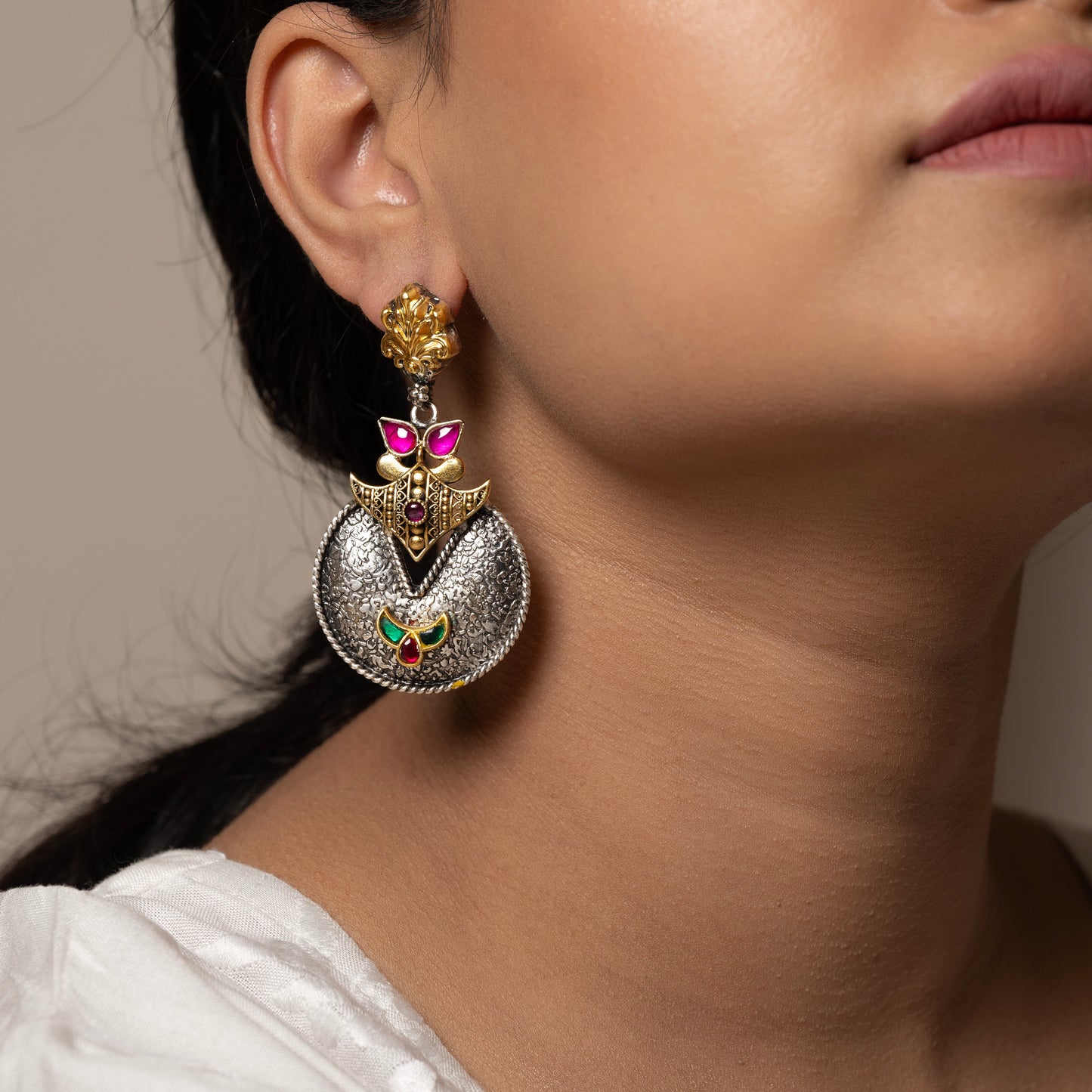 Stunning silver chandbali earrings with intricate detailing, embodying traditional elegance and grace.