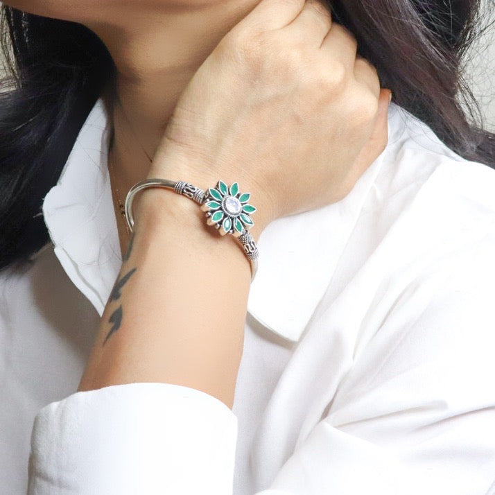 Elegant silver hand cuff or bracelet for women, featuring a sleek and sophisticated design, perfect for adding a touch of refinement to any outfit.