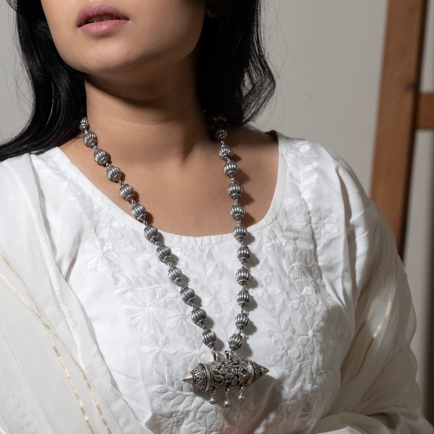 Oxidized sterling silver long necklace with a vintage-inspired charm and a timeless look.