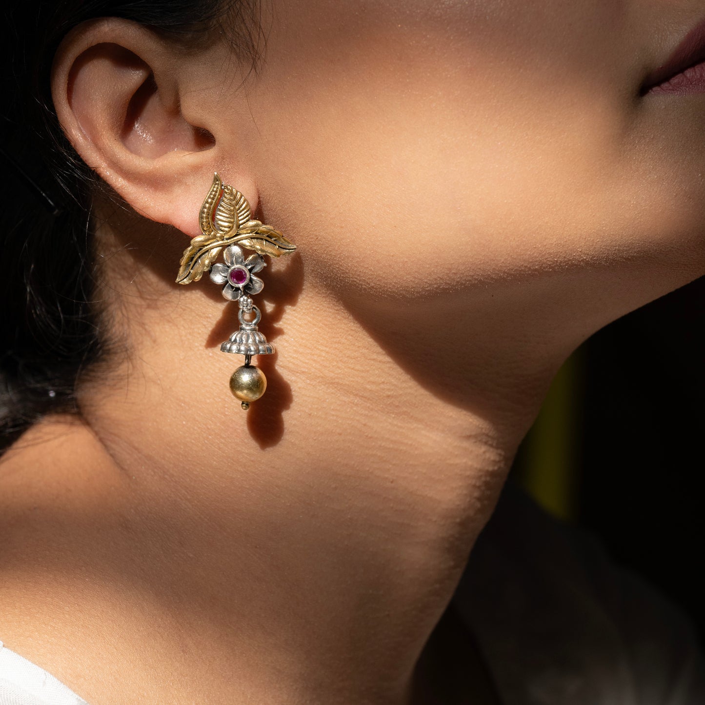 Stunning silver earrings with intricate detailing, embodying traditional elegance and grace.