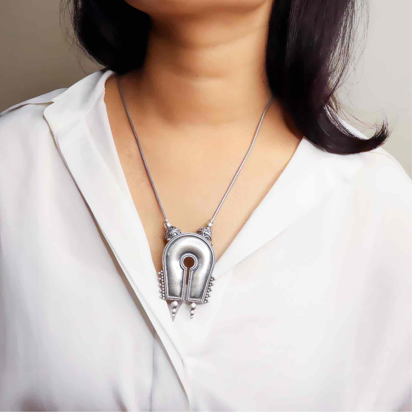 Beautiful oxidized silver necklace with intricate patterns and a vintage finish, offering a bold, antique look for statement styling.