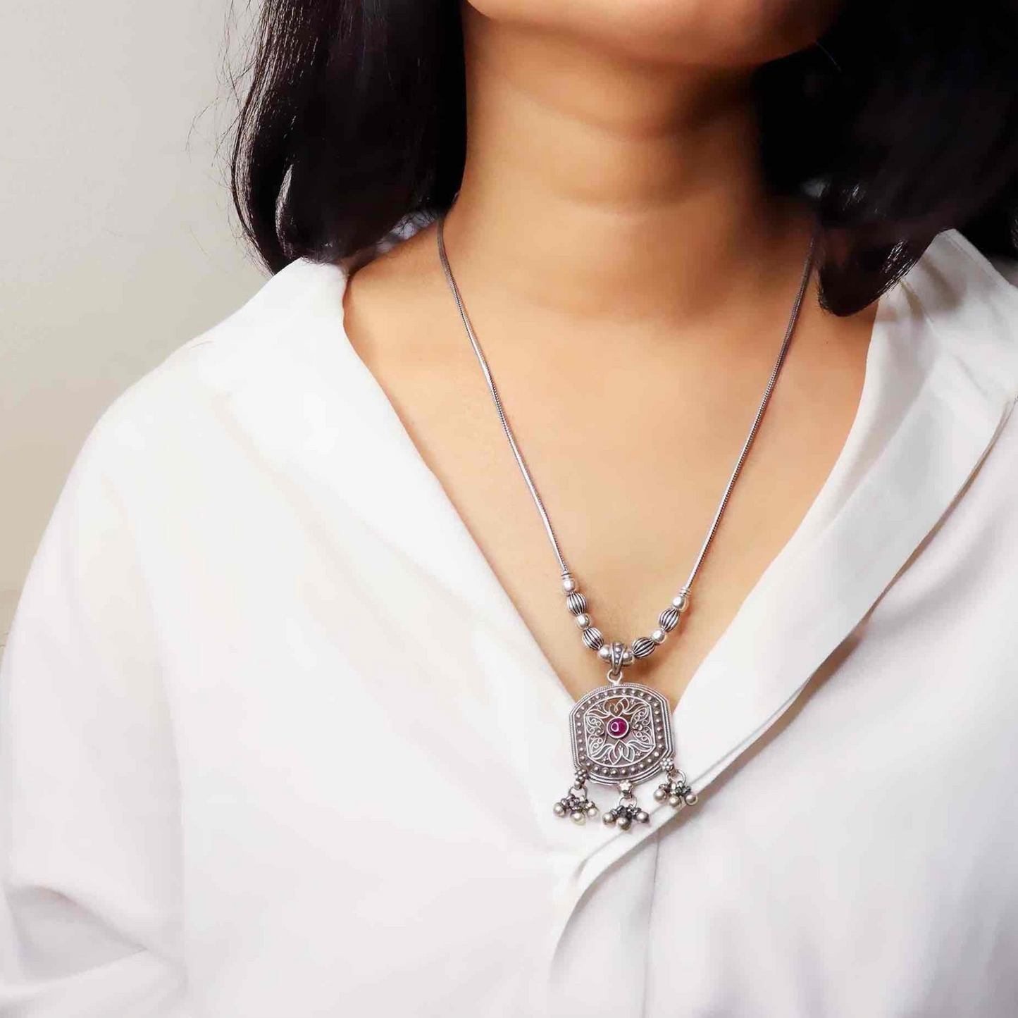 Striking oxidized silver necklace with detailed vintage-inspired patterns, offering a bold, unique look with a timeless, antique finish.