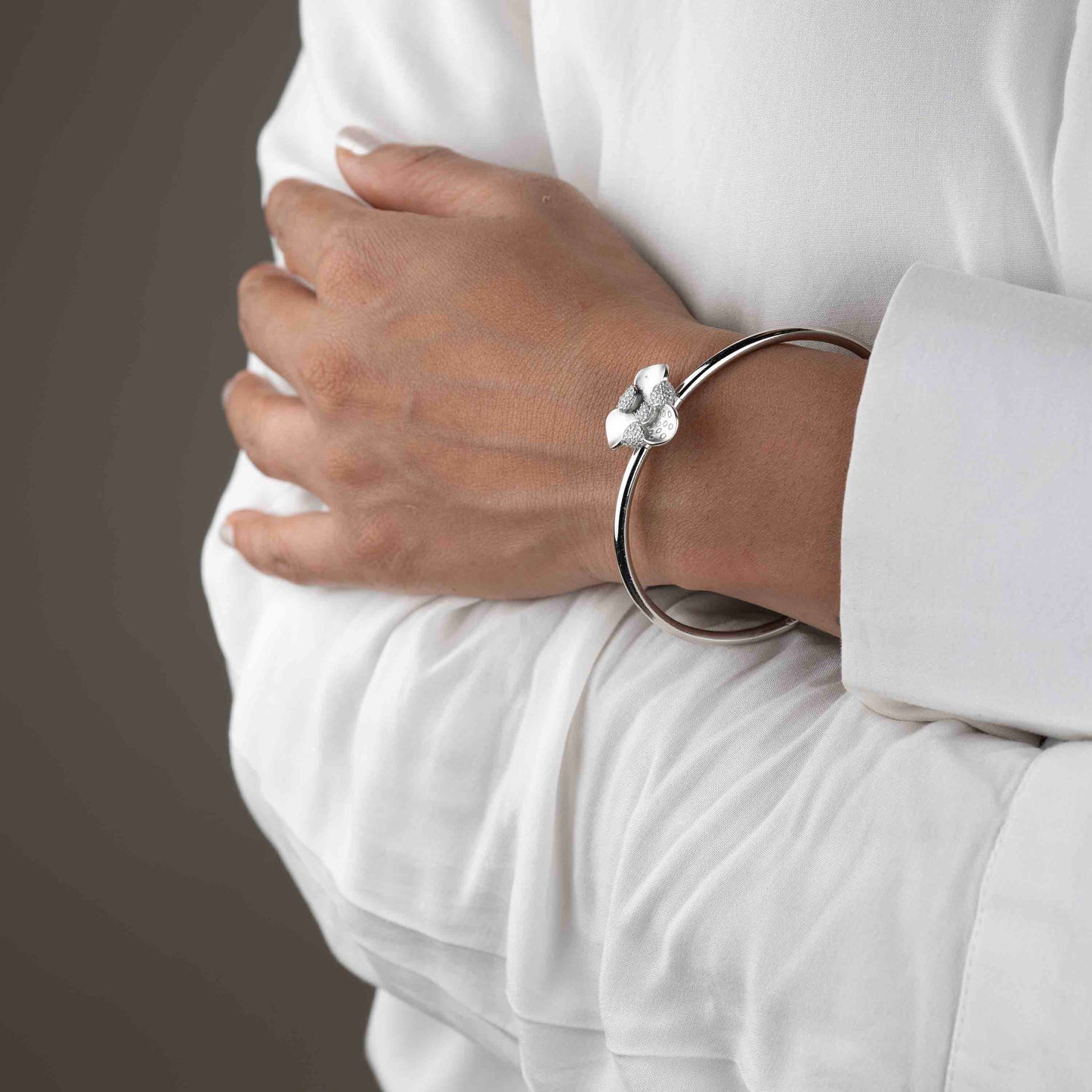 Stylish silver hand cuff or bracelet for women, designed with sleek elegance and modern flair