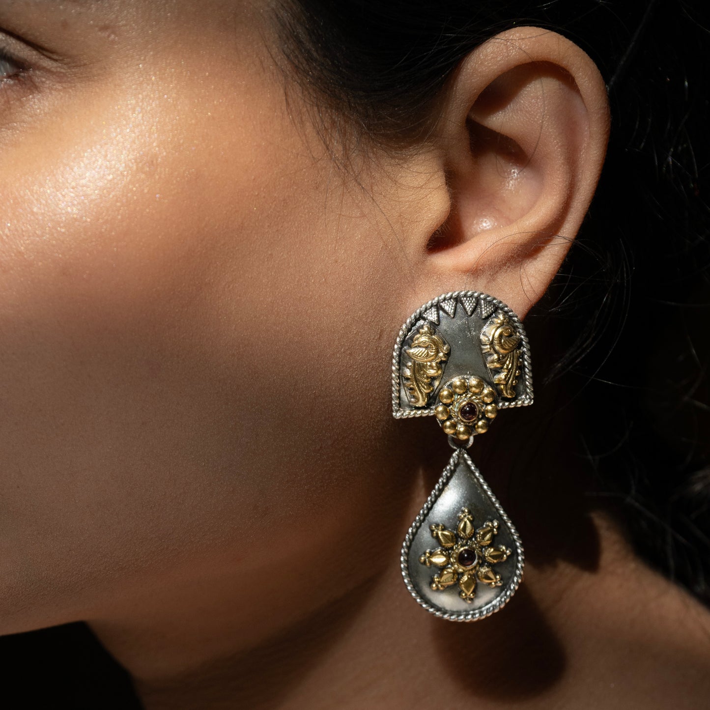 Stunning silver chandbali earrings with intricate detailing, embodying traditional elegance and grace.