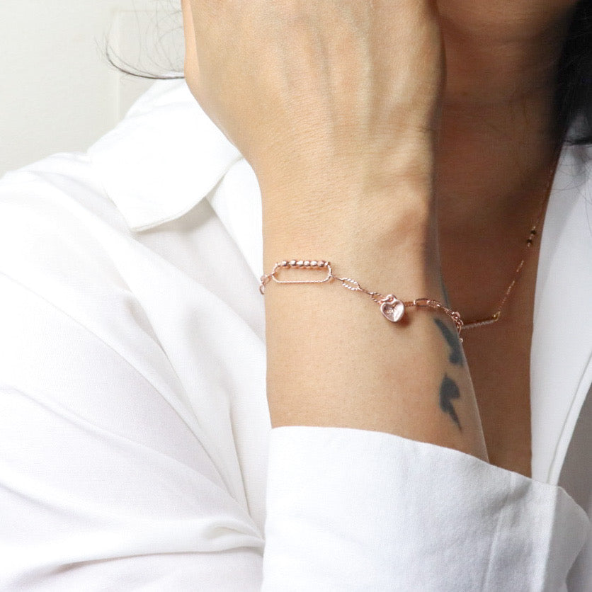 Elegant silver bracelet with a rose gold finish for women, featuring a sleek and sophisticated design, perfect for adding a touch of warmth and luxury to any outfit