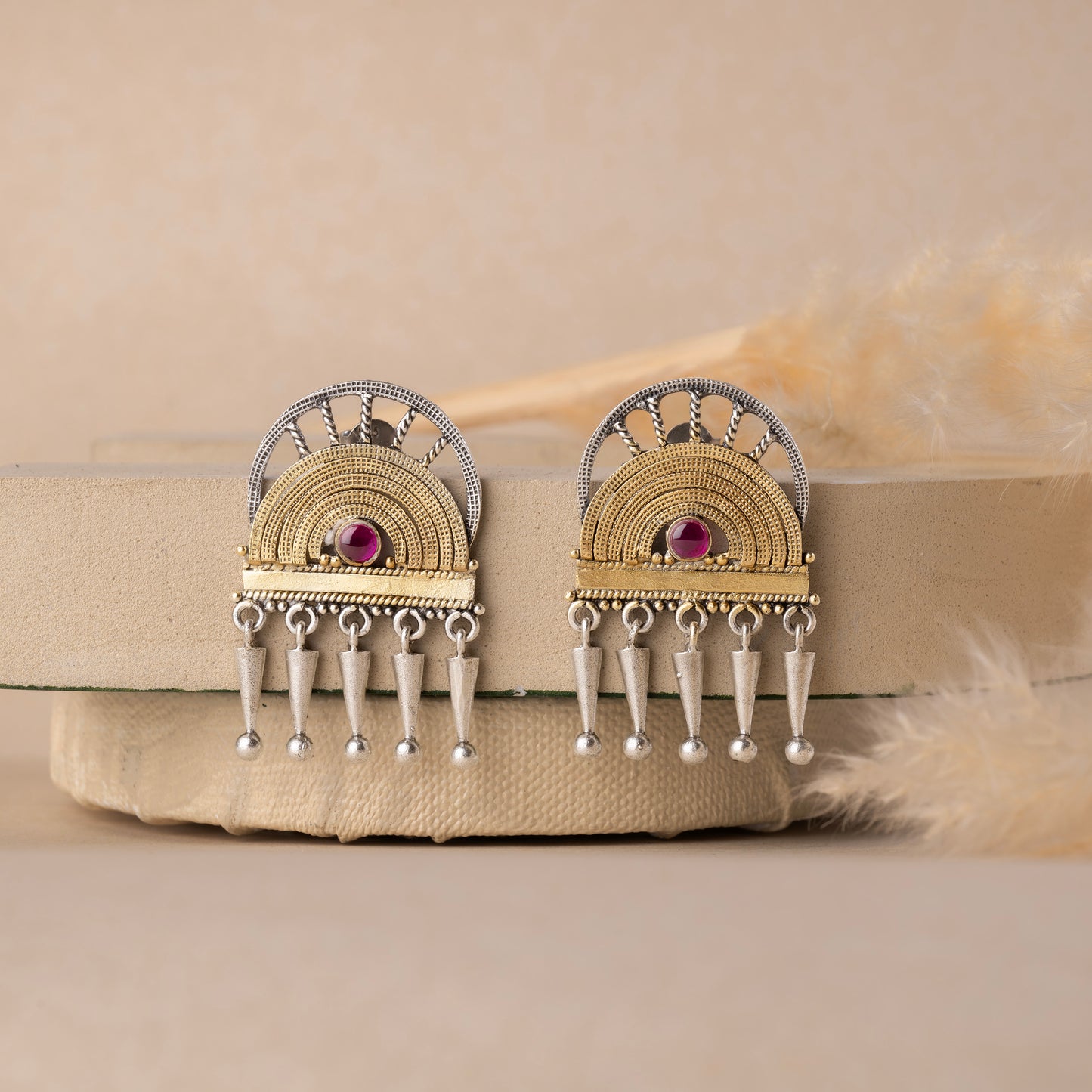 Stunning silver earrings with intricate detailing, embodying traditional elegance and grace.