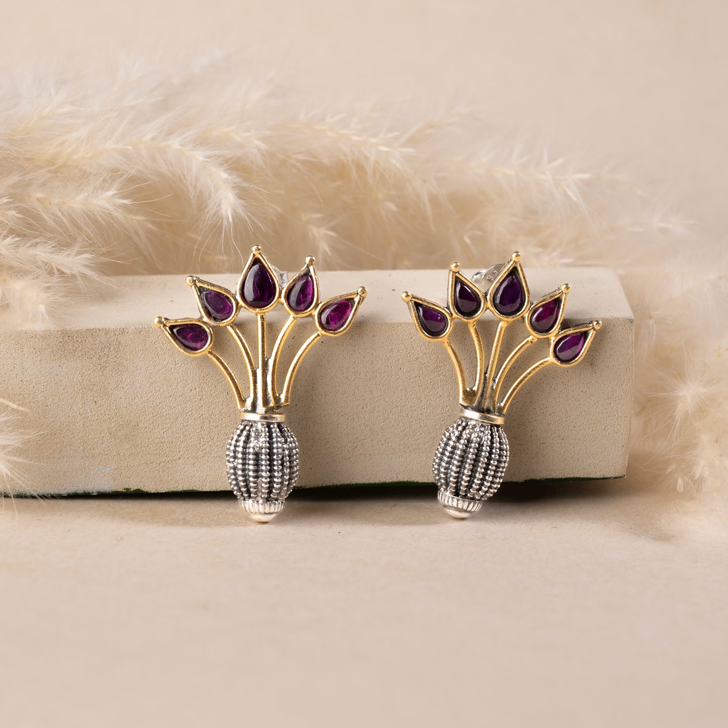 Stunning silver earrings with intricate detailing, embodying traditional elegance and grace.