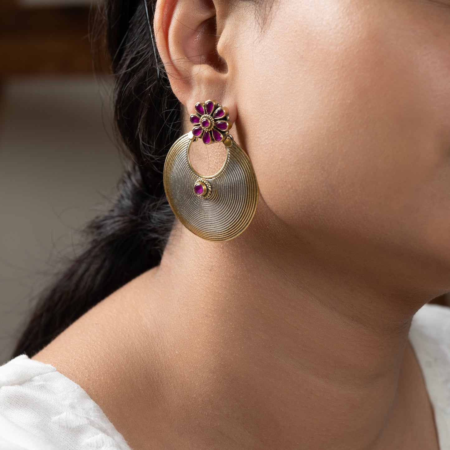 Stunning silver chandbali earrings with intricate detailing, embodying traditional elegance and grace.
