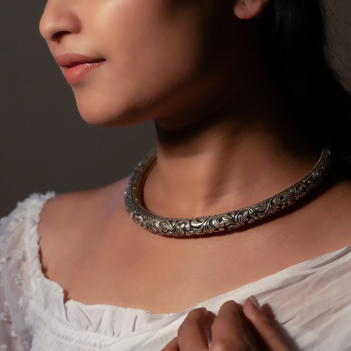 Beautiful oxidized silver choker with intricate patterns and a vintage finish, offering a bold, antique look for statement styling.