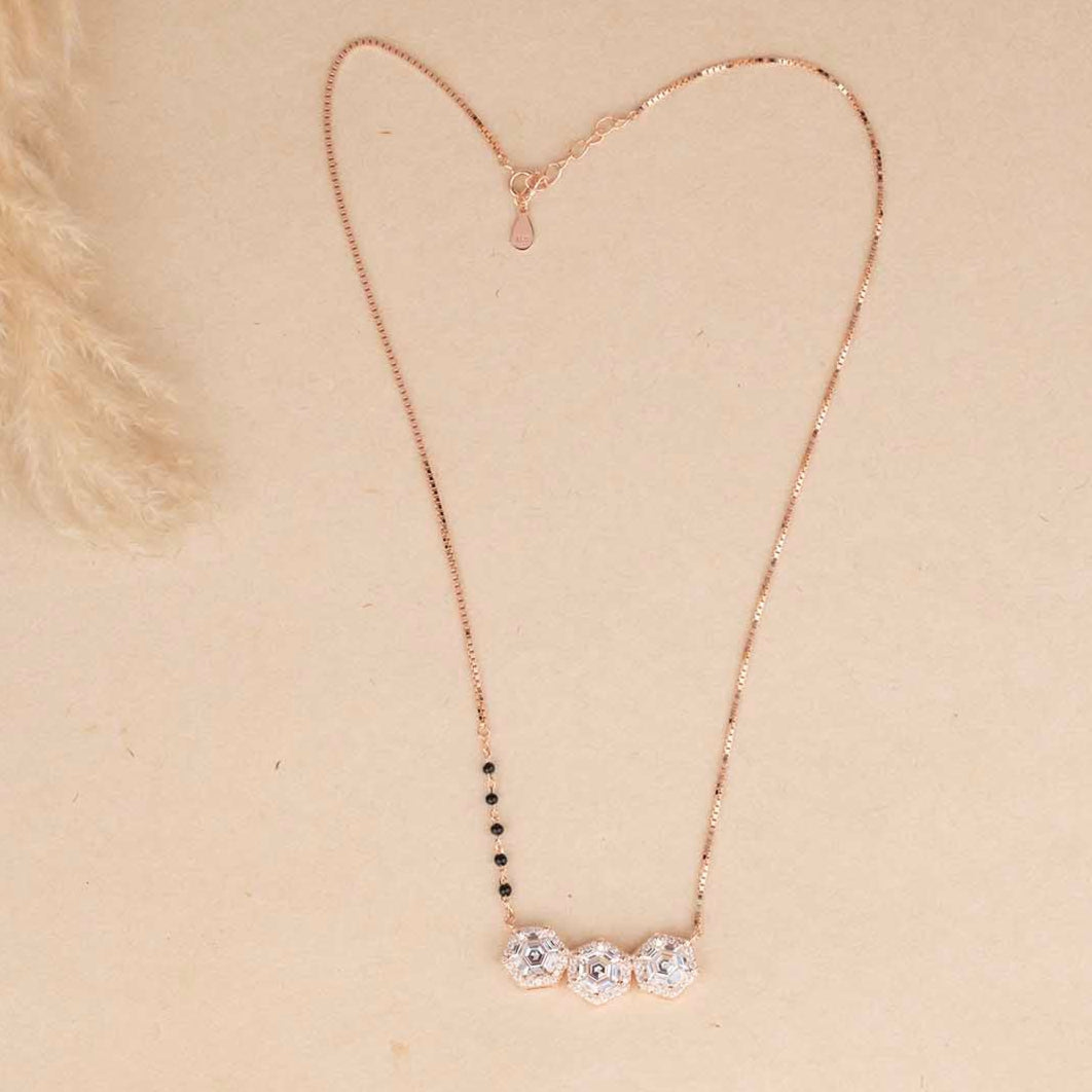 Necklace with a heart-shaped pendant on a beige background