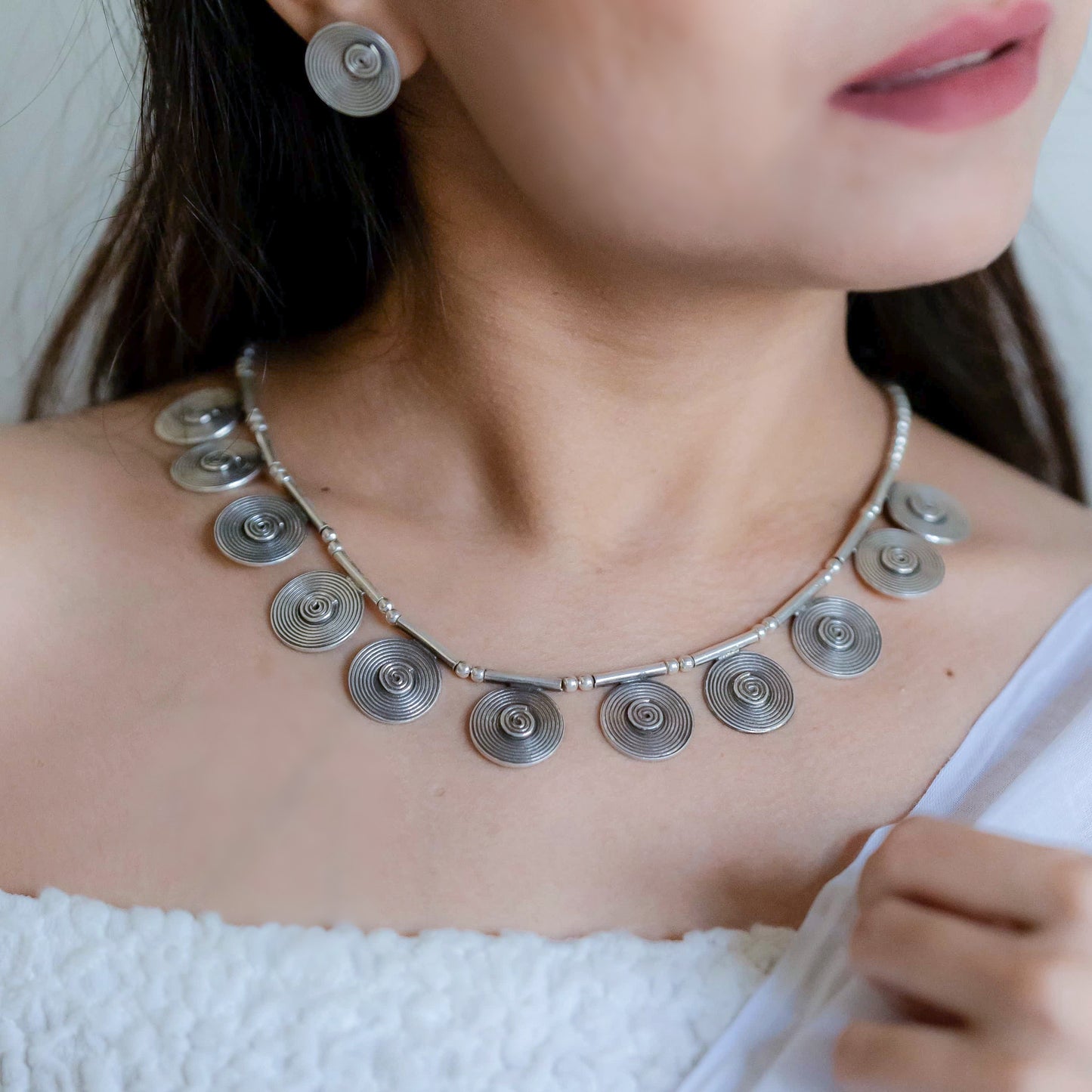 Striking oxidized silver necklace with detailed vintage-inspired patterns, offering a bold, unique look with a timeless, antique finish.