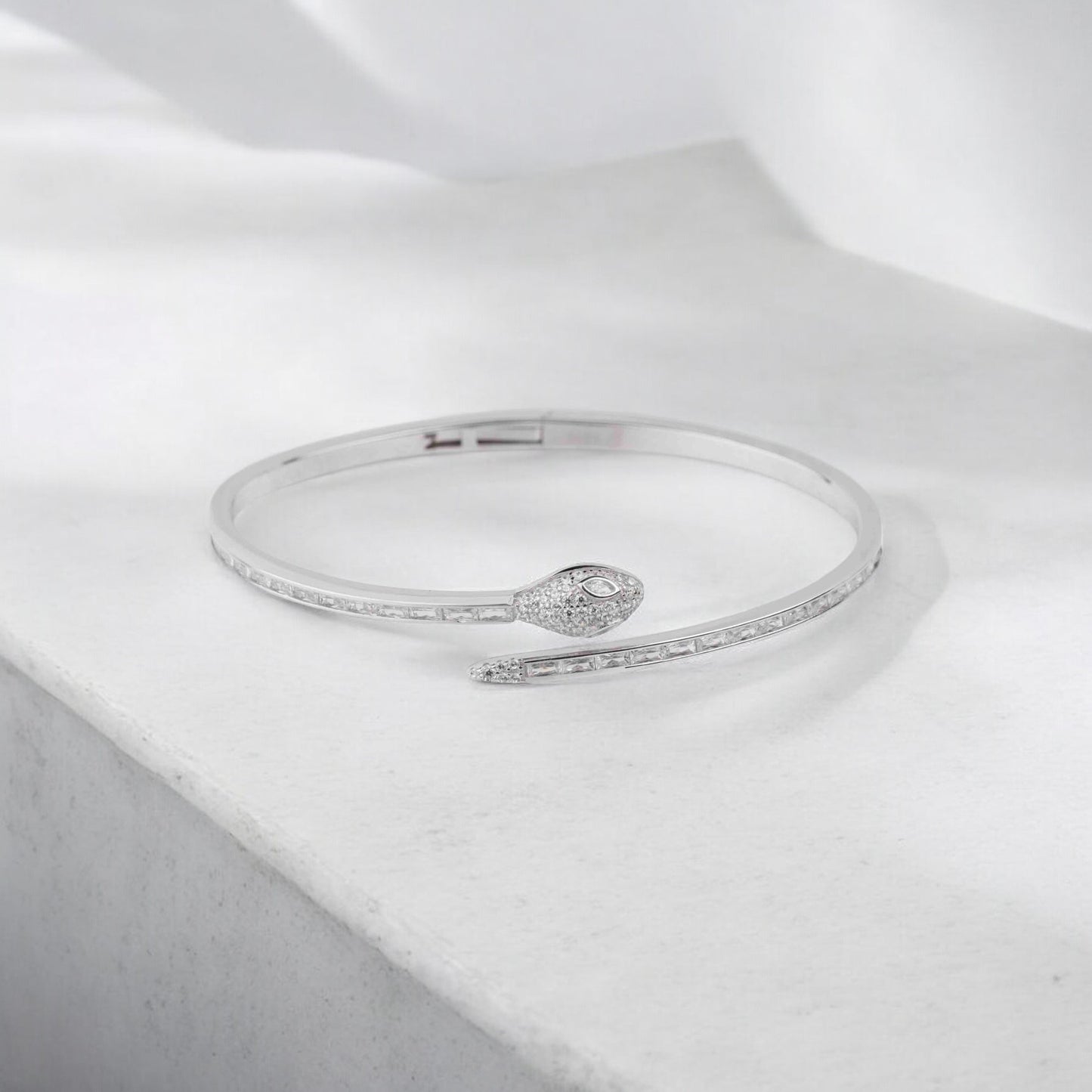 Stylish silver bracelet with a snake design, featuring a sleek and modern look perfect for women seeking a unique and elegant accessory