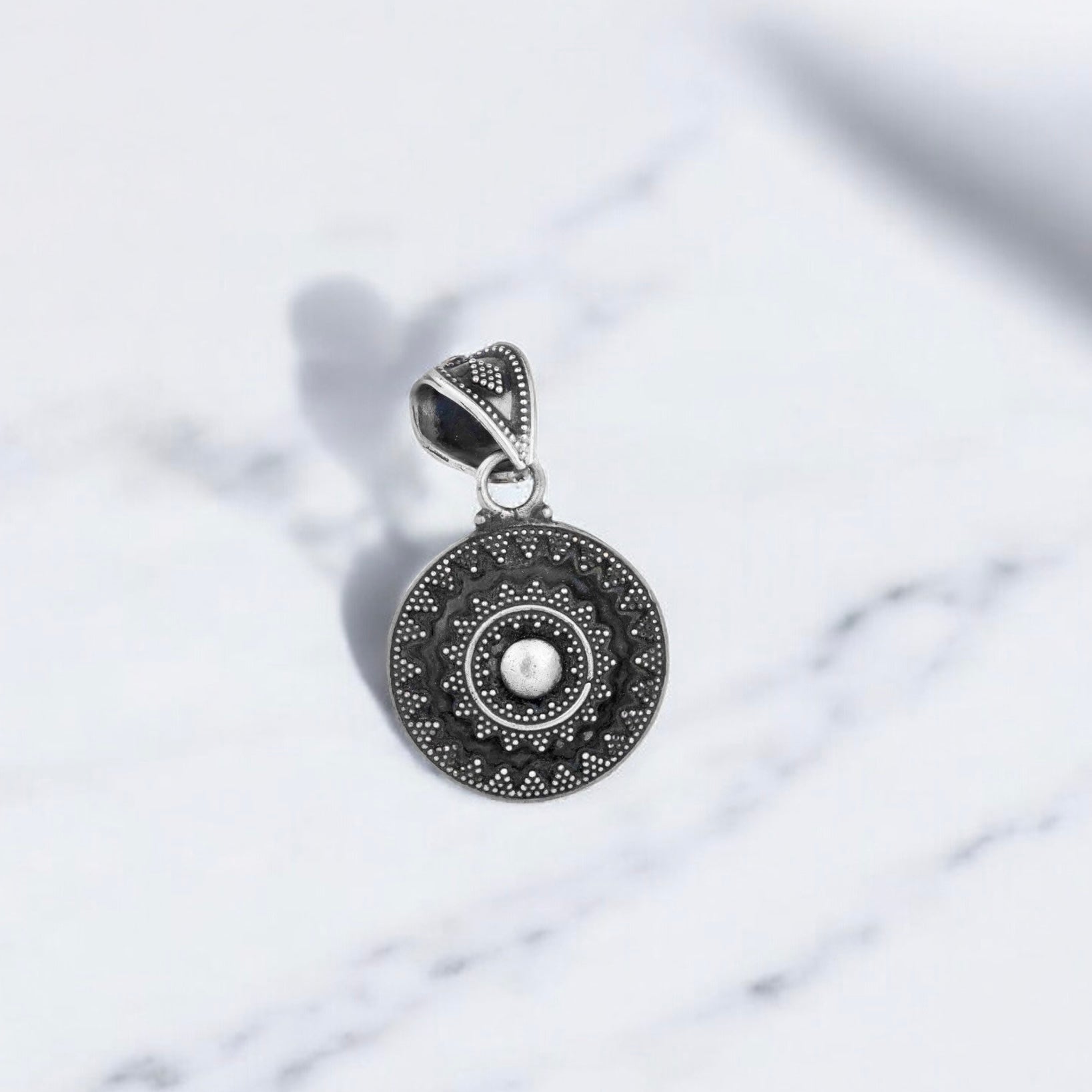 Simple sterling silver pendant with a oxidised finish perfect for everyday wear.