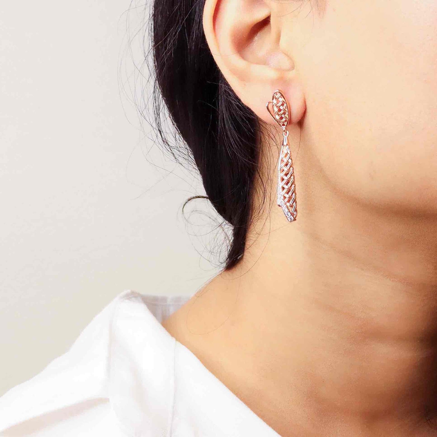 Elegant silver long earrings with a radiant rose gold finish, exuding timeless sophistication and modern flair