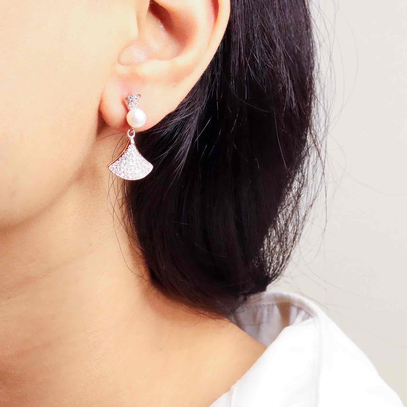 Elegant silver long earrings with a radiant rose gold finish, exuding timeless sophistication and modern flair