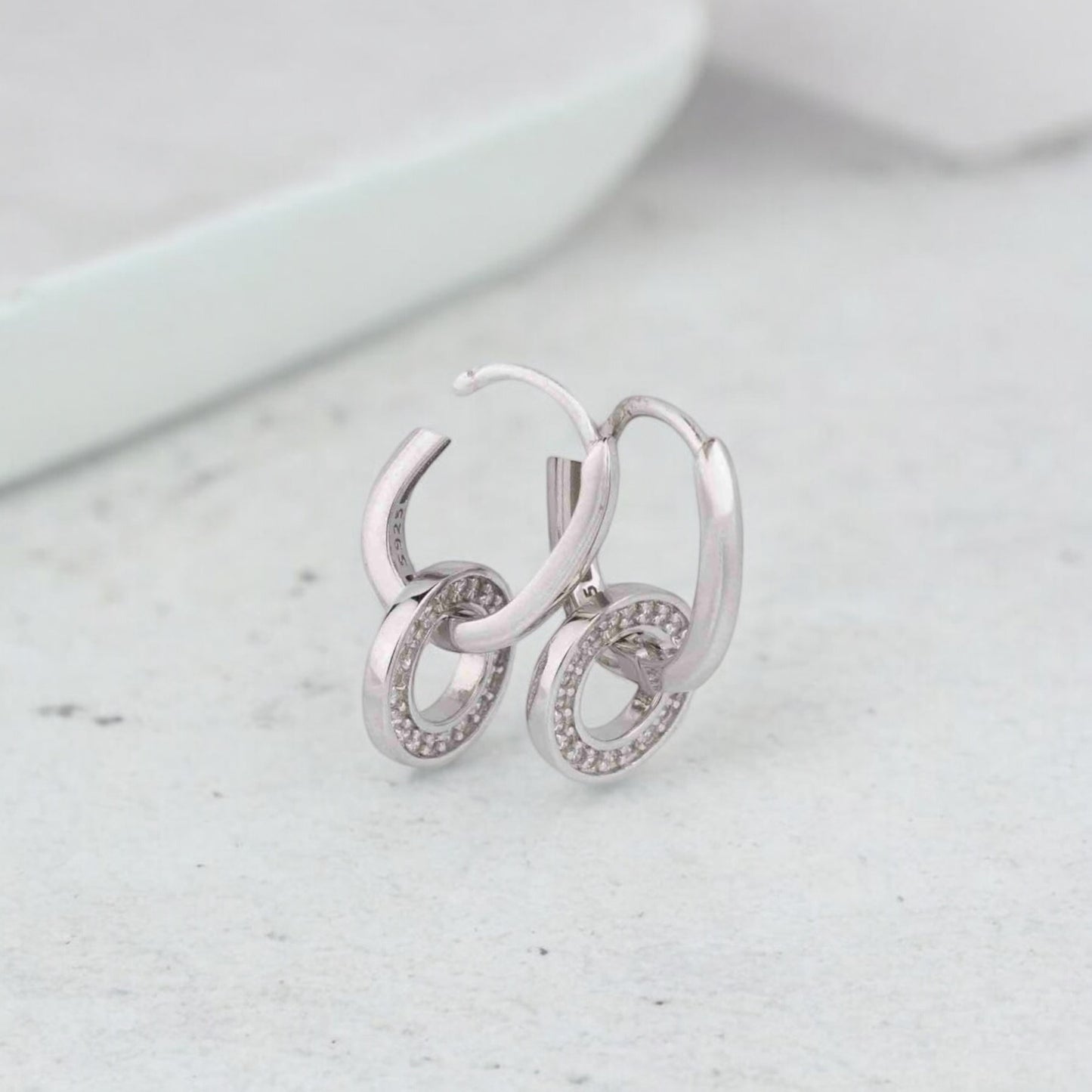 Stylish silver earrings featuring a sleek and modern design for everyday elegance