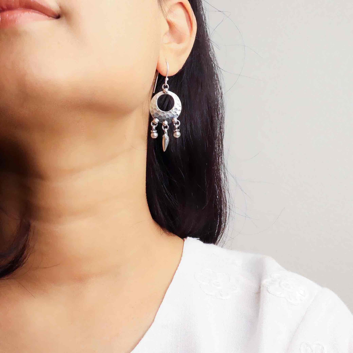 Elegant silver oxidized long earrings with intricate patterns and vintage-inspired charm