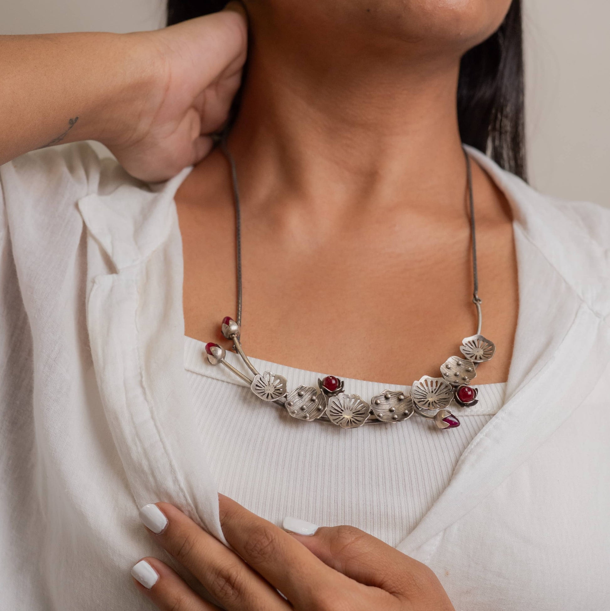 Striking oxidized silver necklace with detailed vintage-inspired patterns, offering a bold, unique look with a timeless, antique finish.