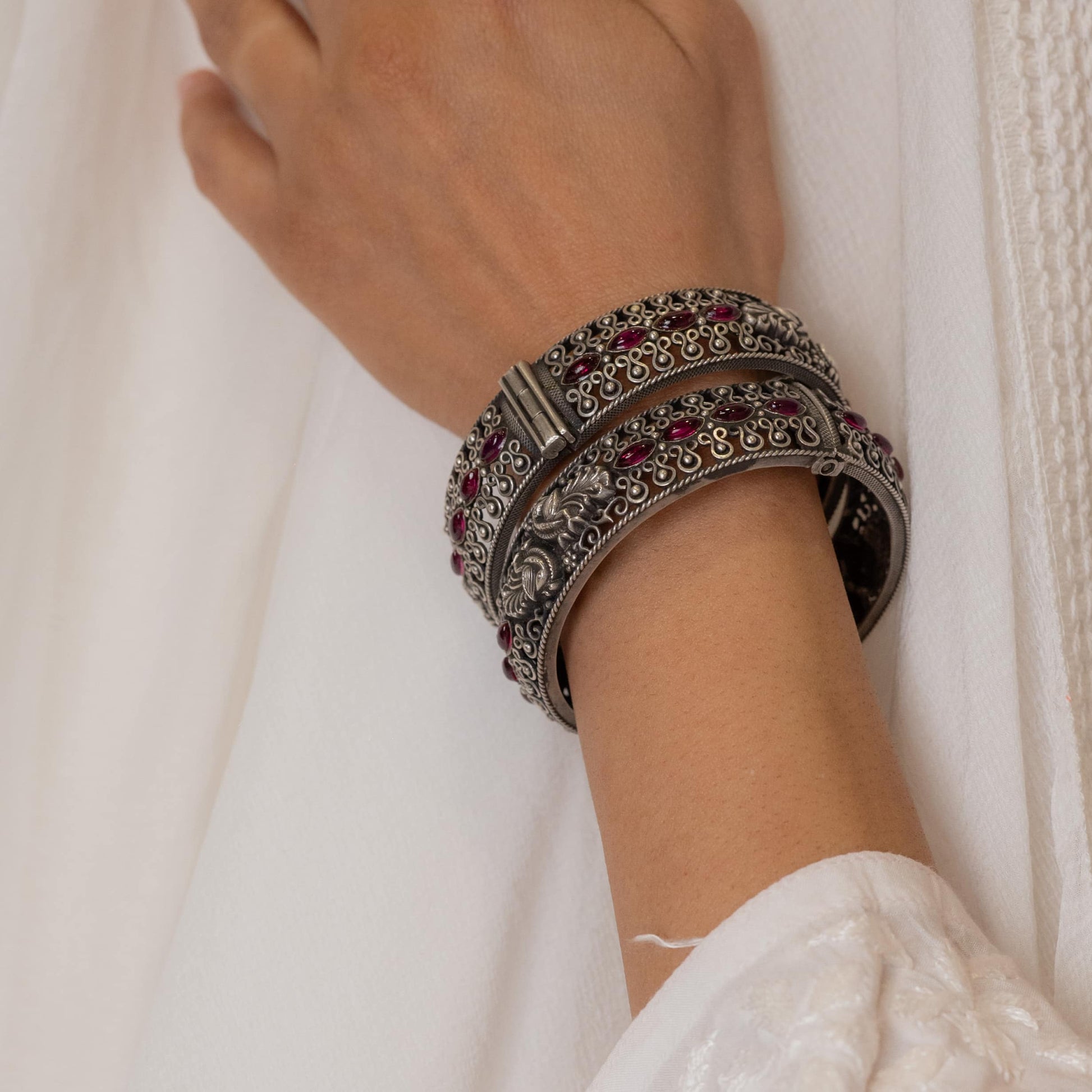 Oxidized silver bangle with intricate ethnic-inspired patterns, perfect for traditional attire.