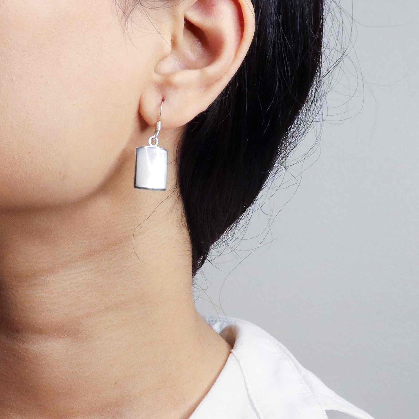 Stylish silver earrings featuring a sleek and modern design for everyday elegance