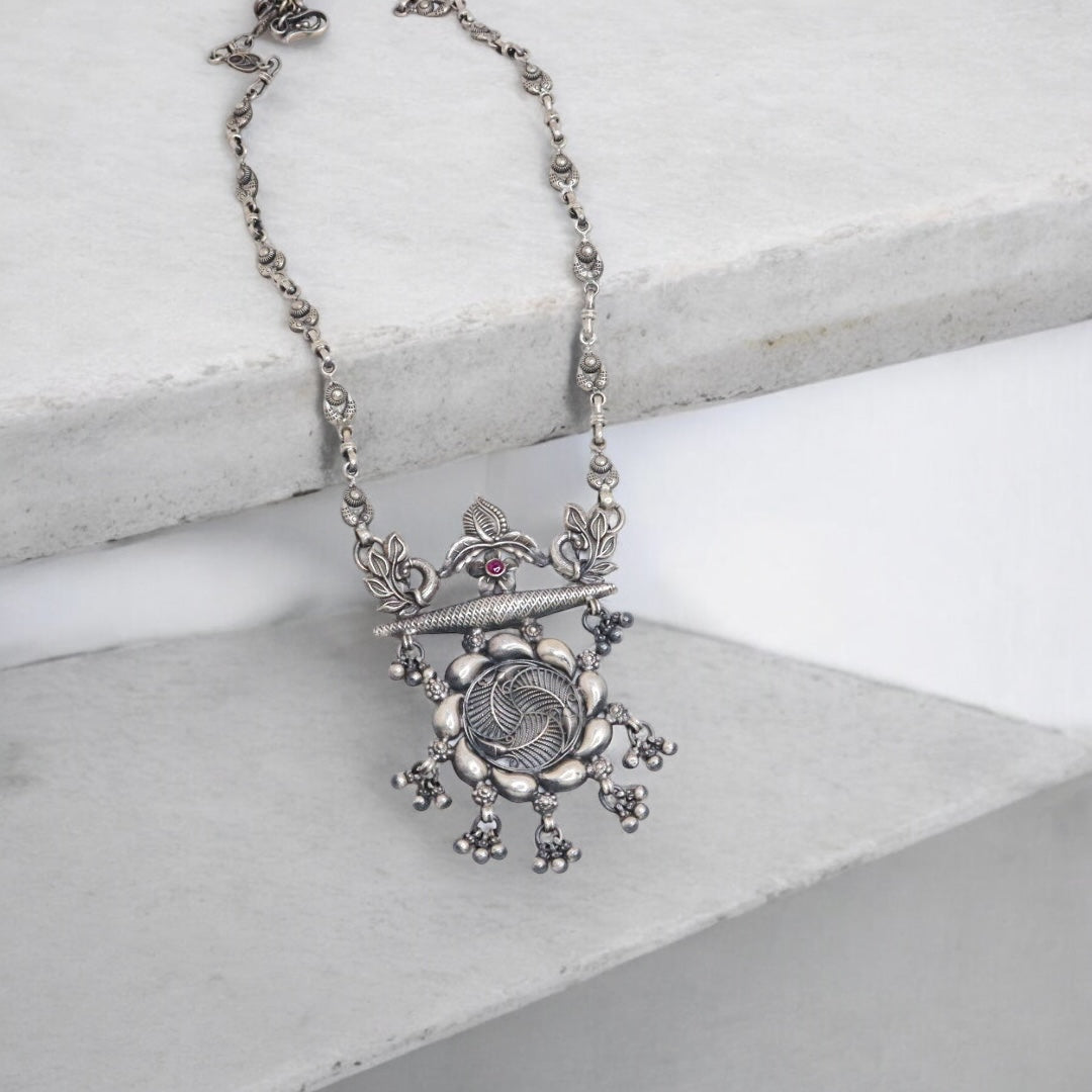 Striking oxidized silver necklace with detailed vintage-inspired patterns, offering a bold, unique look with a timeless, antique finish.