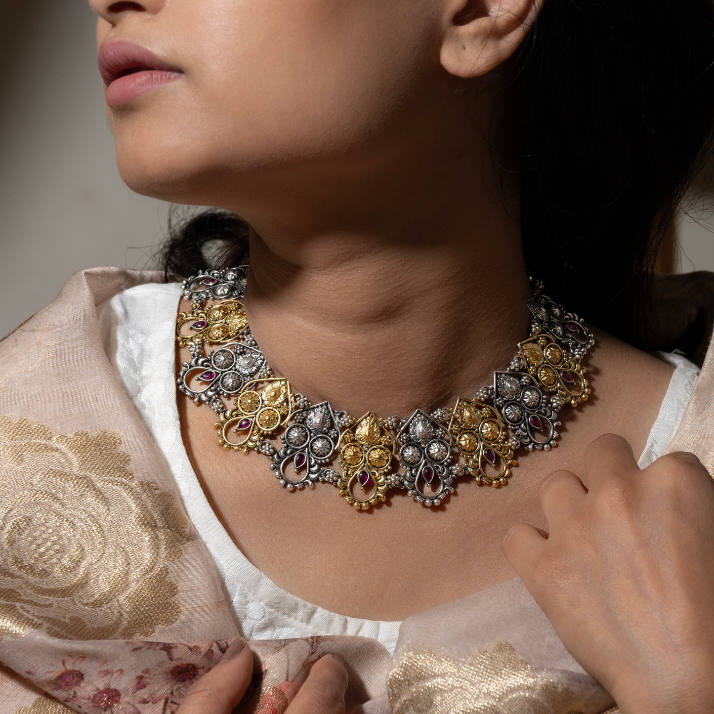 Stylish silver choker necklace featuring a delicate floral pattern, adding a touch of sophistication