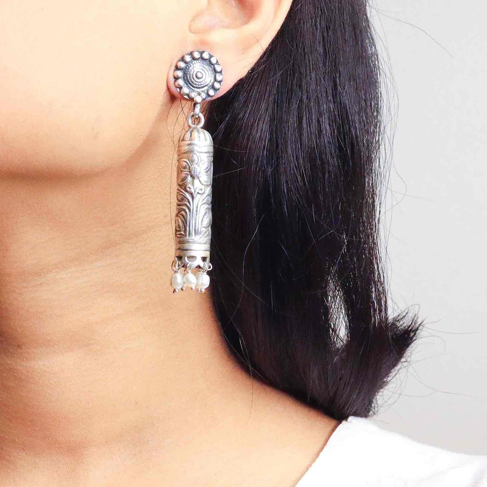 Elegant silver oxidized long earrings with intricate patterns and vintage-inspired charm