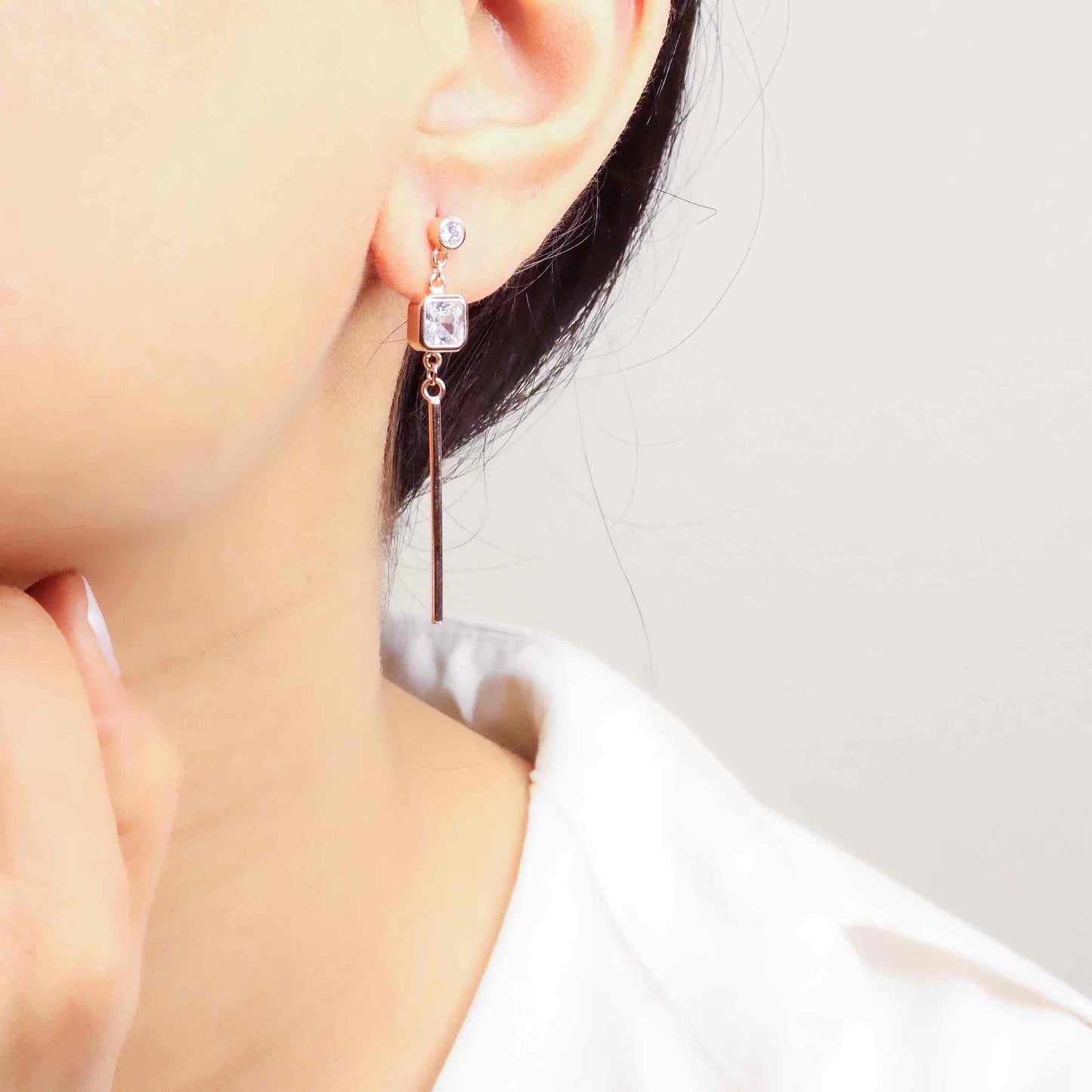 Elegant silver long earrings with a radiant rose gold finish, exuding timeless sophistication and modern flair