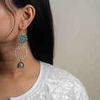 Intricately designed silver oxidized jhumka earrings with a traditional and vintage-inspired charm.
