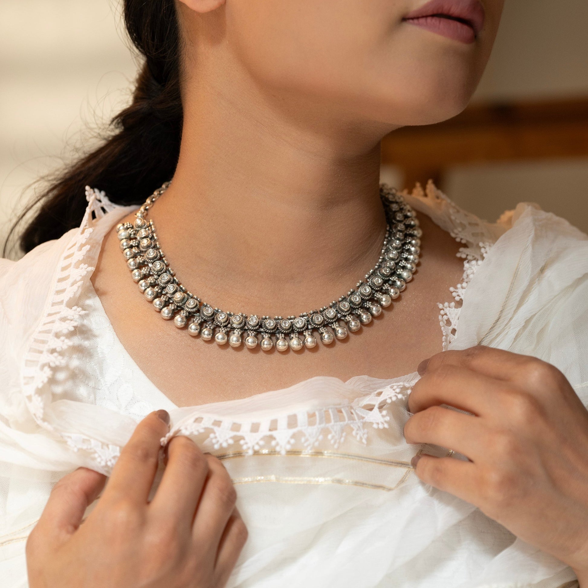 Oxidized silver choker with antique finish, showcasing a detailed motif for a vintage aesthetic