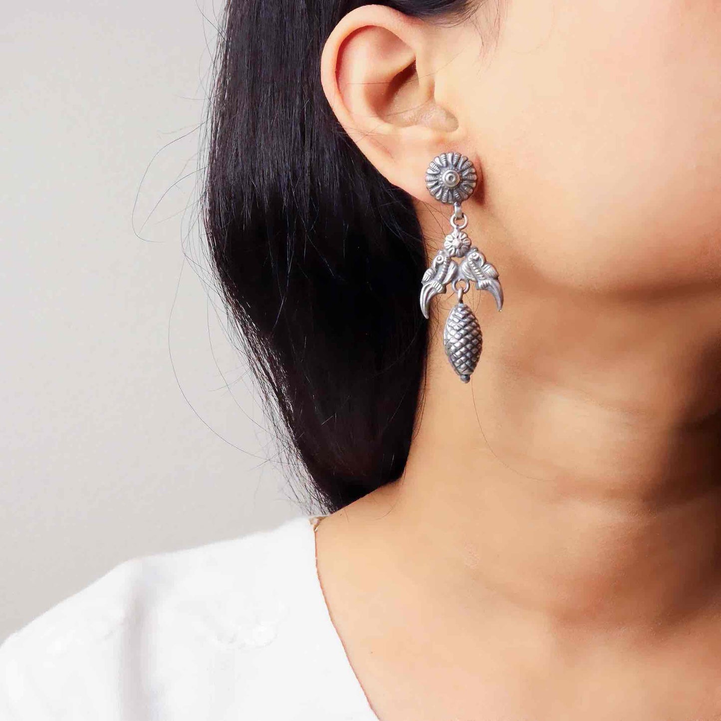 Elegant silver oxidized long earrings with intricate patterns and vintage-inspired charm