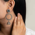 Intricately designed silver oxidized jhumka earrings with a traditional and vintage-inspired charm.