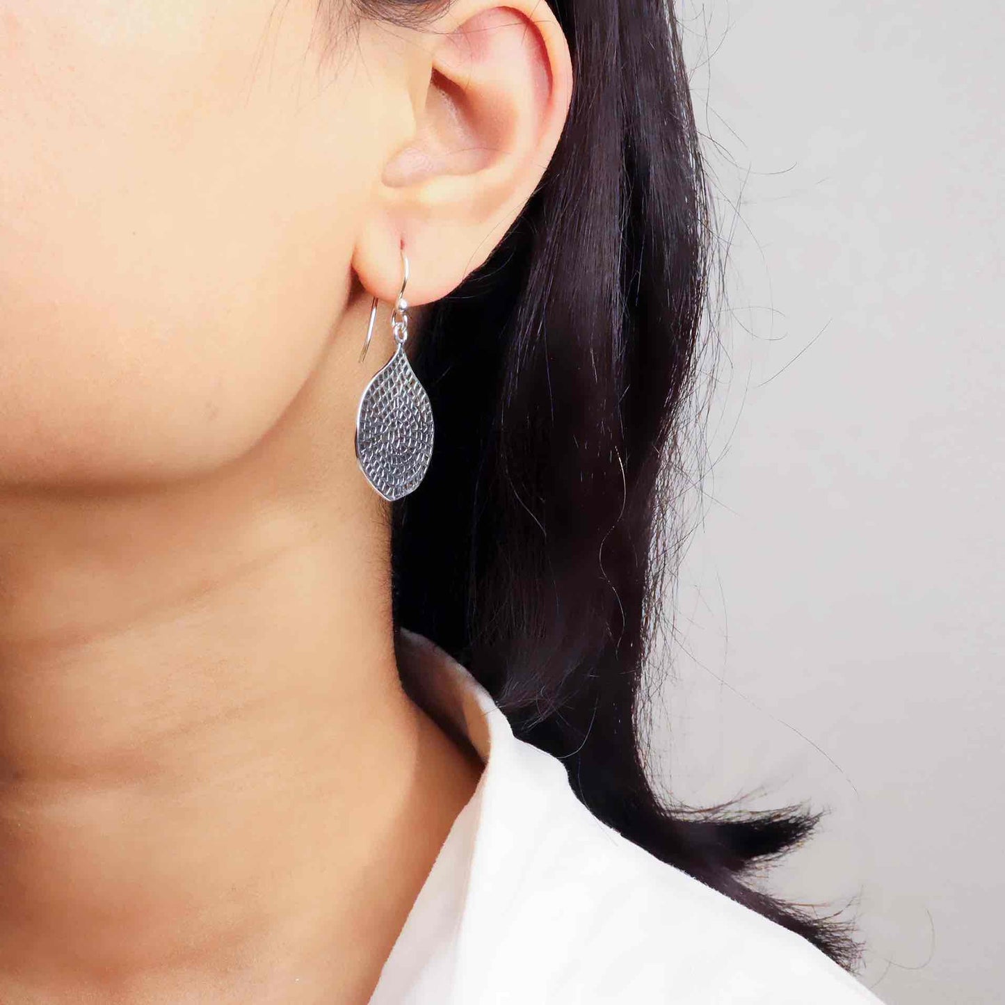 Stylish silver earrings featuring a sleek and modern design for everyday elegance