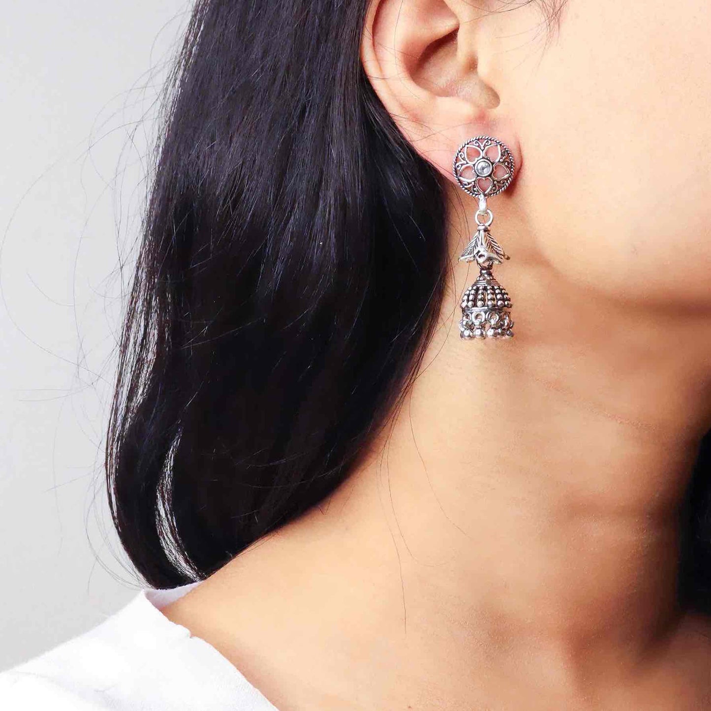 Intricately designed silver oxidized jhumka earrings with a traditional and vintage-inspired charm.