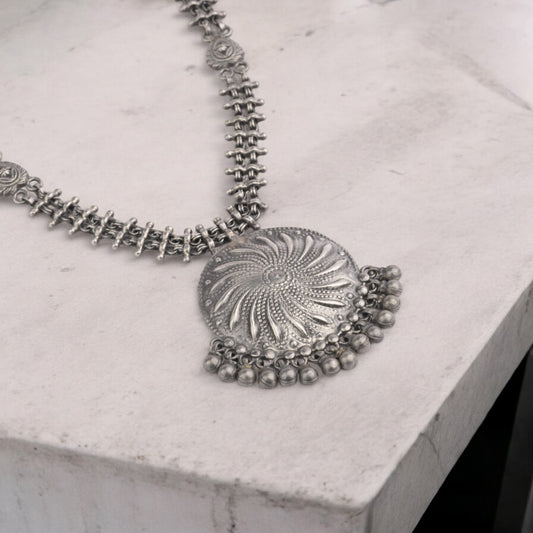 Striking oxidized silver necklace with detailed vintage-inspired patterns, offering a bold, unique look with a timeless, antique finish.