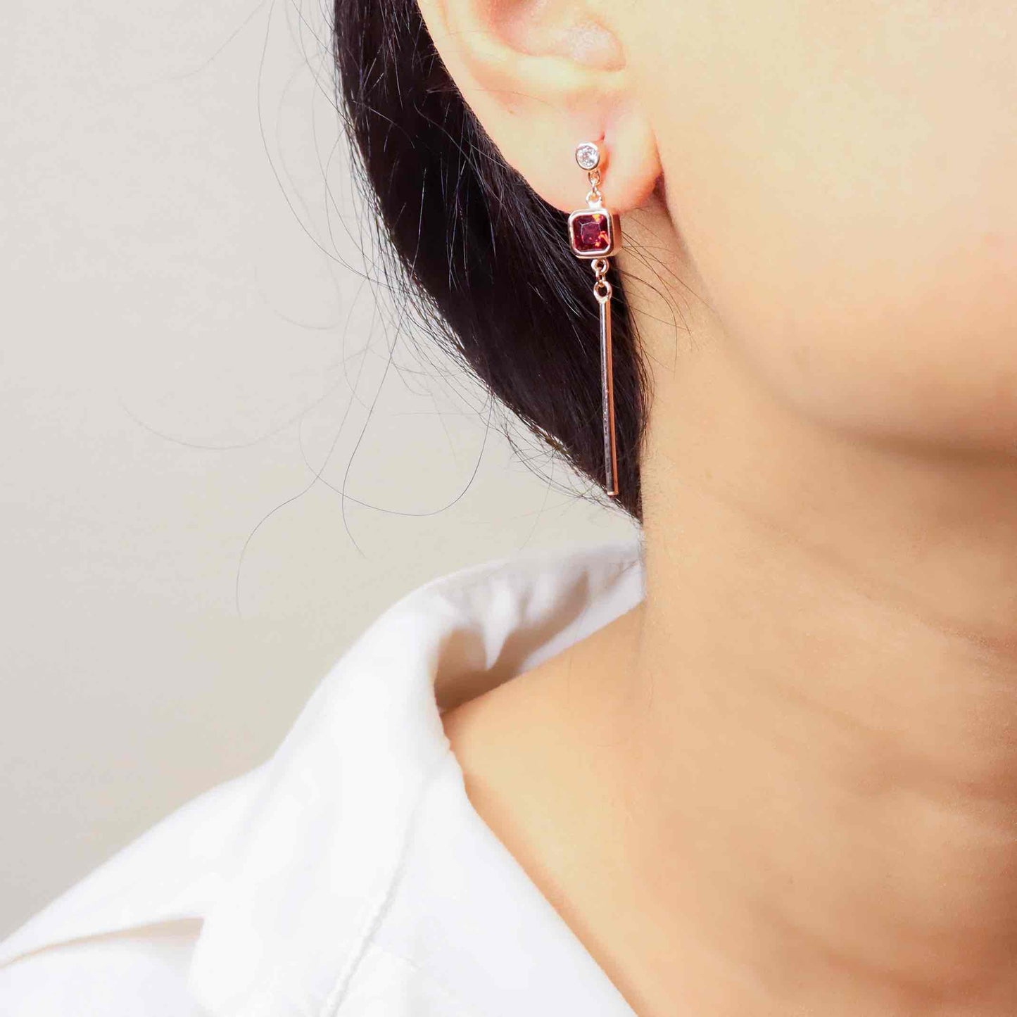 Elegant silver long earrings with a radiant rose gold finish, exuding timeless sophistication and modern flair