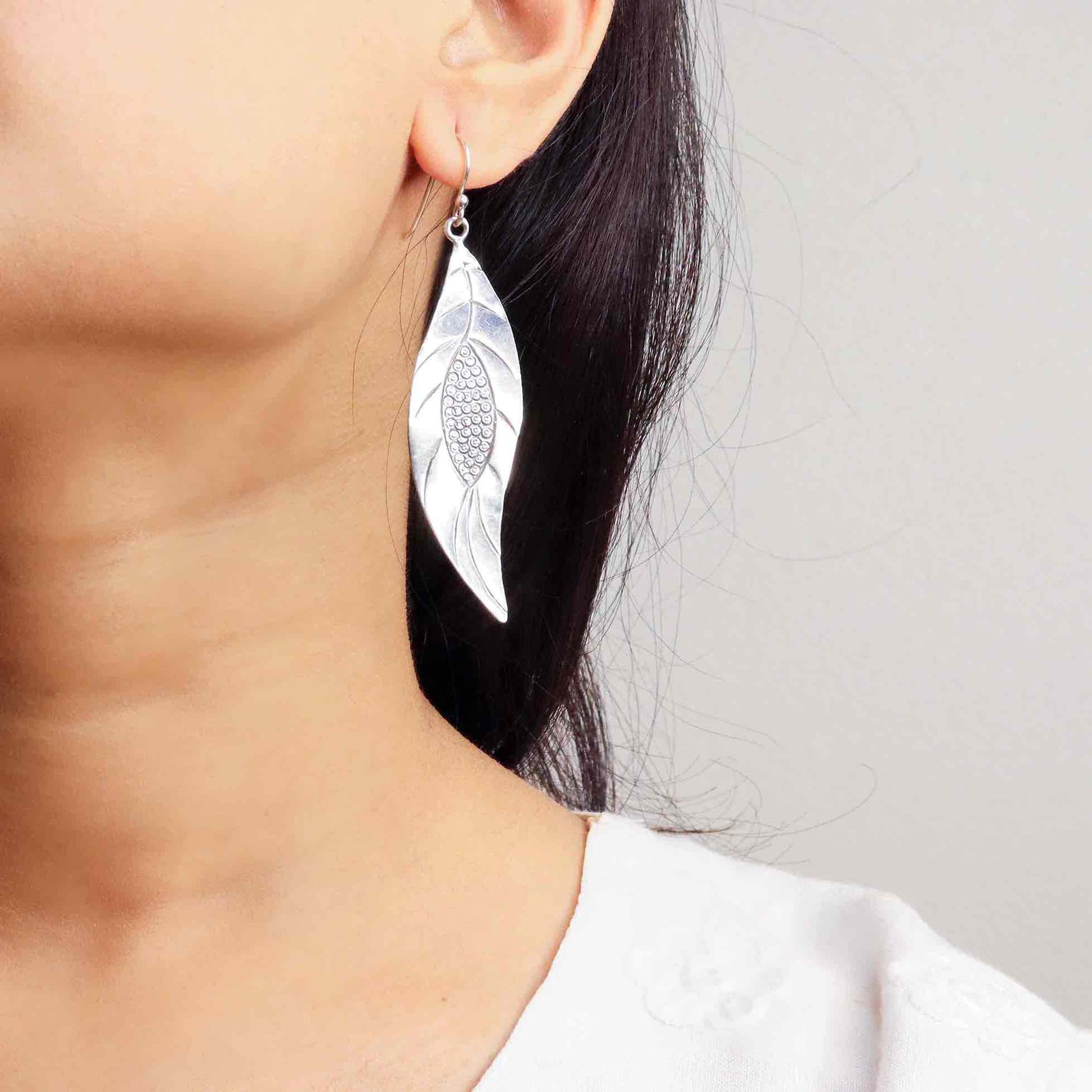 Lightweight silver earrings offering effortless elegance and comfort for daily wear.