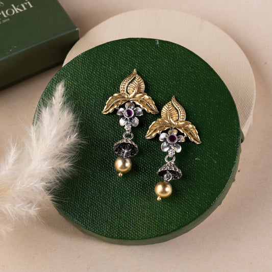 Stunning silver earrings with intricate detailing, embodying traditional elegance and grace. 