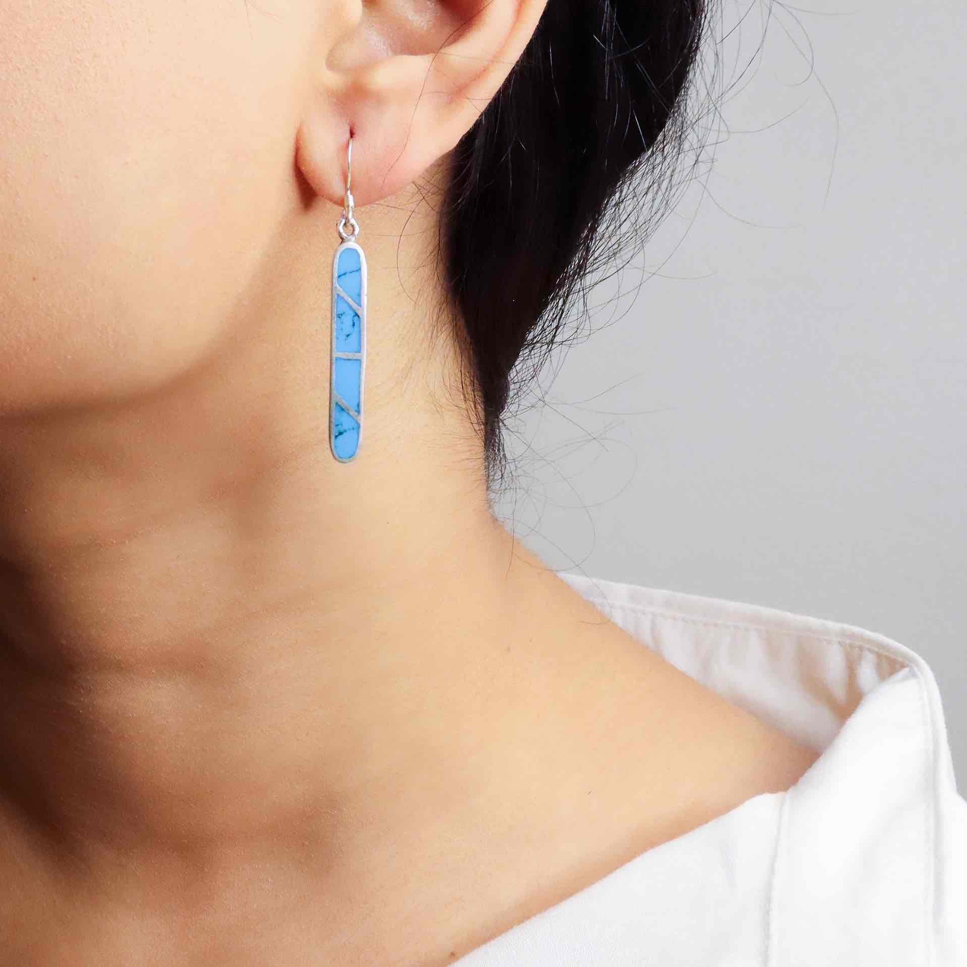 Stylish silver earrings featuring a sleek and modern design for everyday elegance