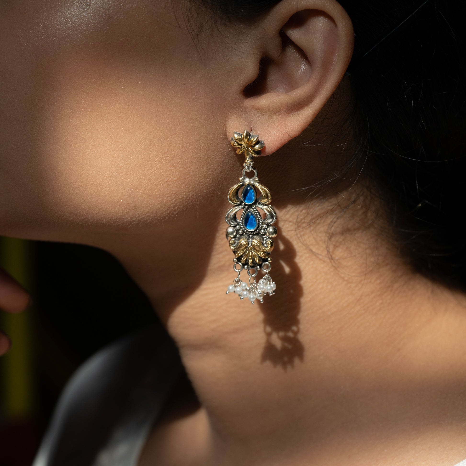 Stunning silver earrings with intricate detailing, embodying traditional elegance and grace. 