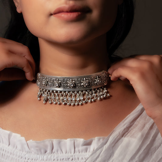 Oxidized silver choker with antique finish, showcasing a detailed motif for a vintage aesthetic