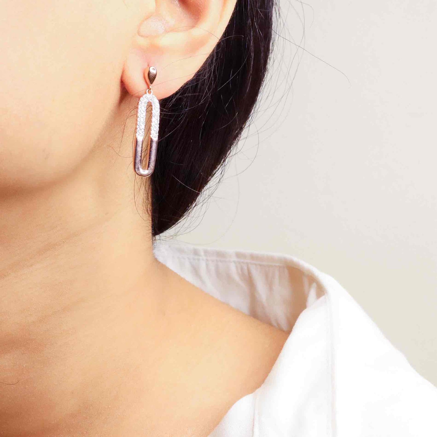 Elegant silver long earrings with a radiant rose gold finish, exuding timeless sophistication and modern flair