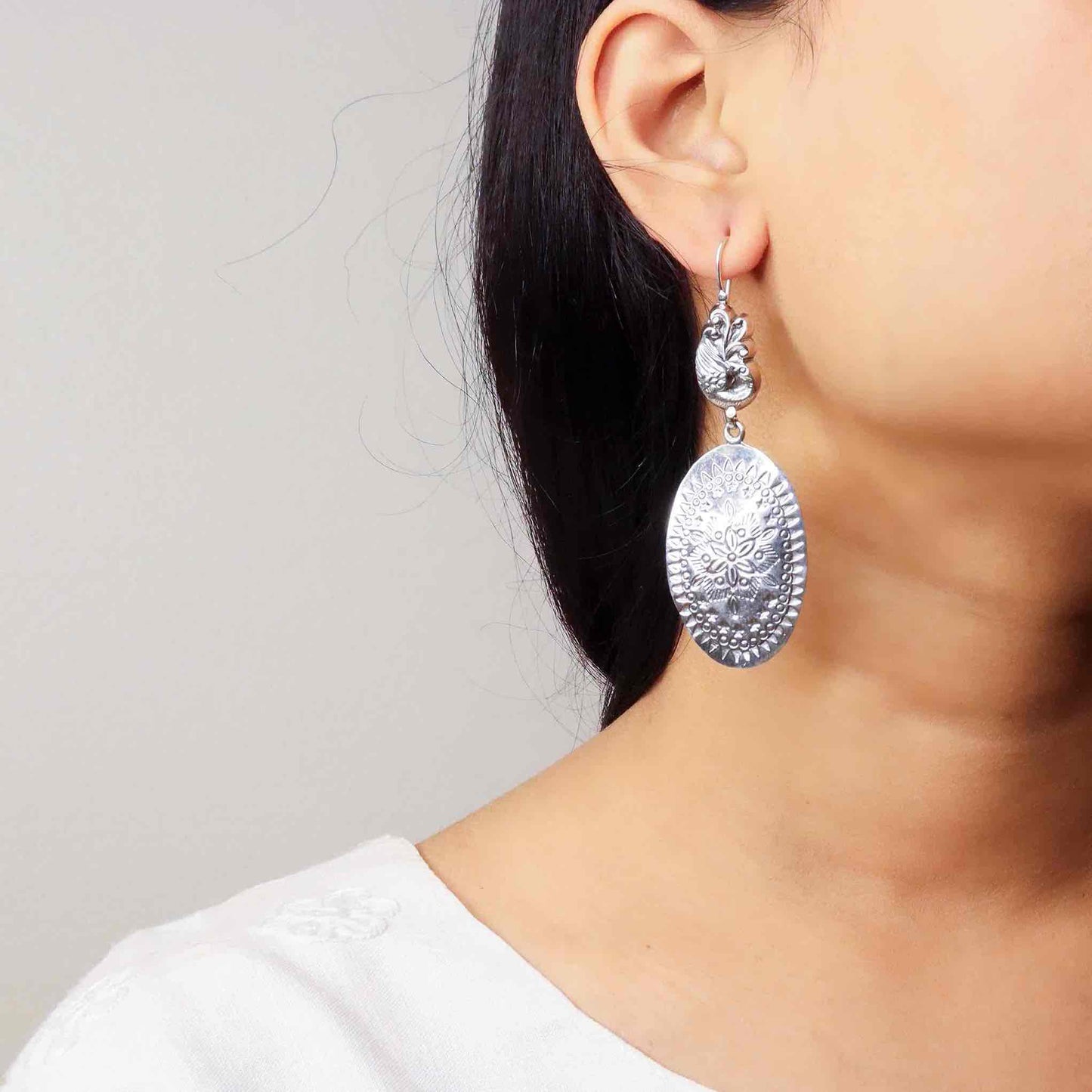 Elegant silver oxidized long earrings with intricate patterns and vintage-inspired charm