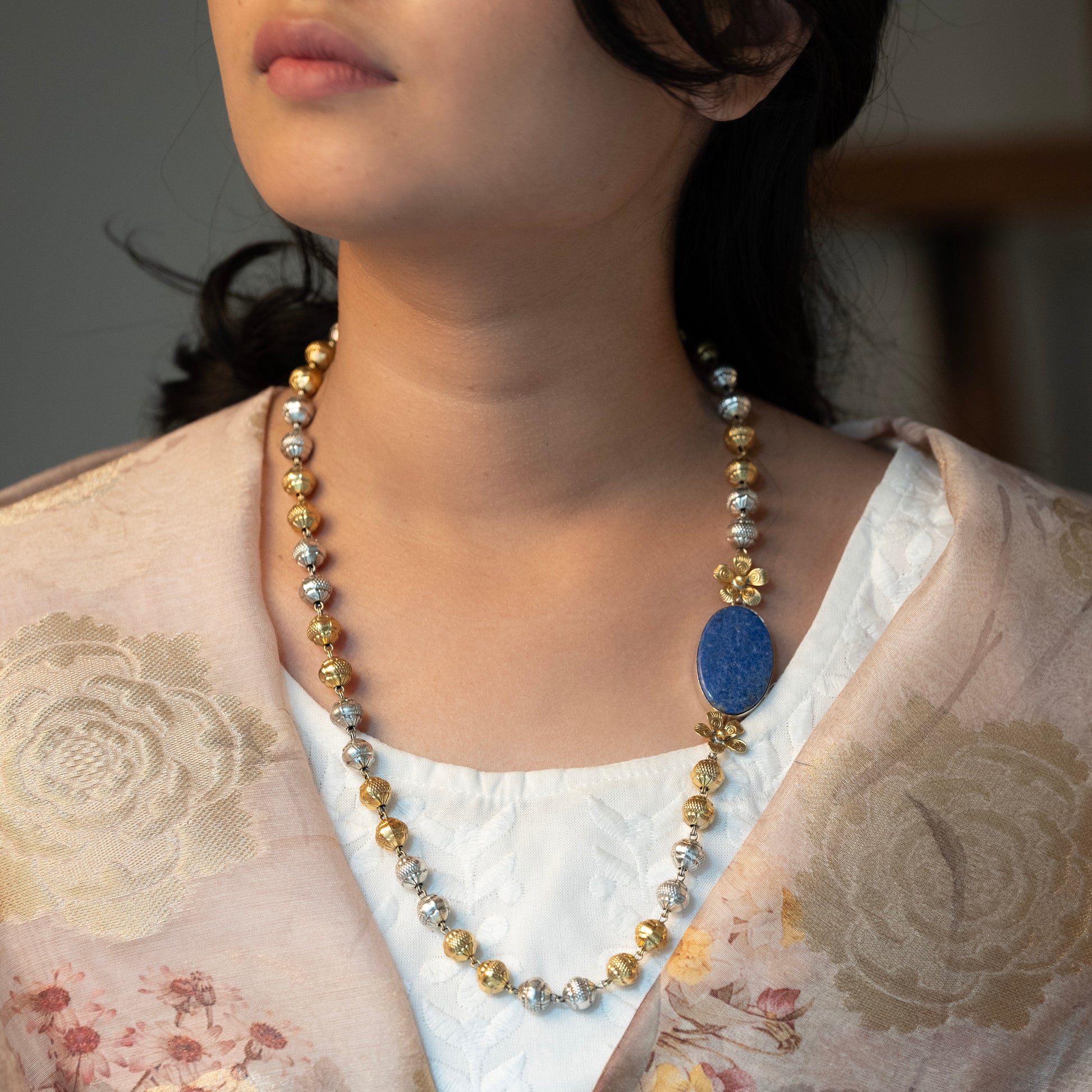 "Long sterling silver necklace with a big blue colour stone, adding a touch of sophistication to any outfit.