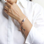 Stylish silver bracelet with a snake design, featuring a sleek and modern look perfect for women seeking a unique and elegant accessory
