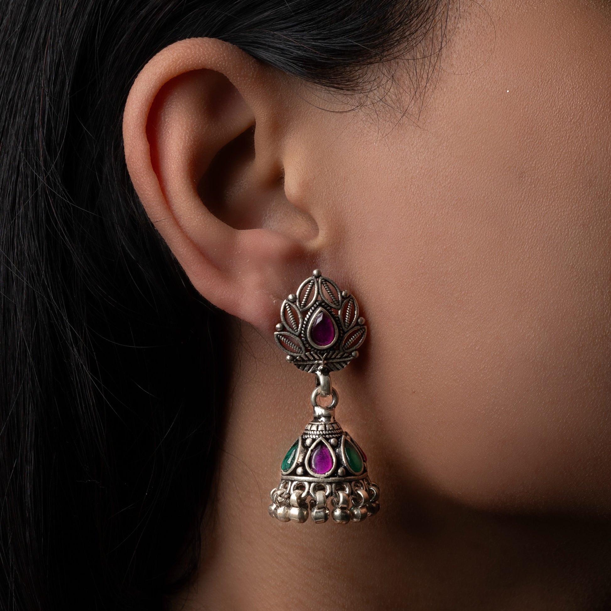 Intricately designed silver oxidized jhumka earrings with a traditional and vintage-inspired charm.