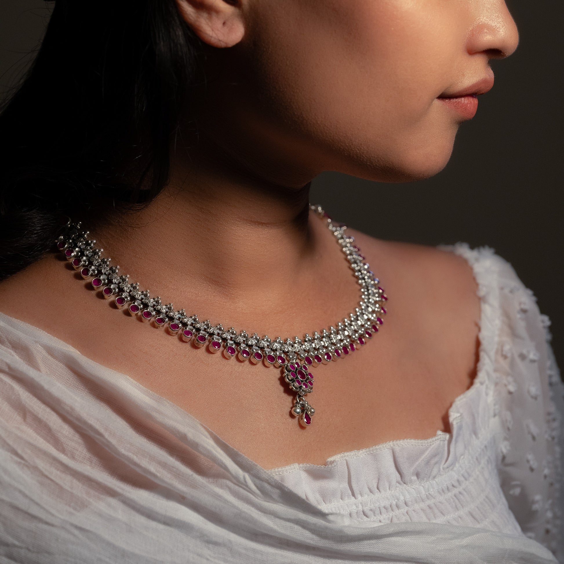 "Oxidized silver choker with antique finish, showcasing a detailed motif for a vintage aesthetic