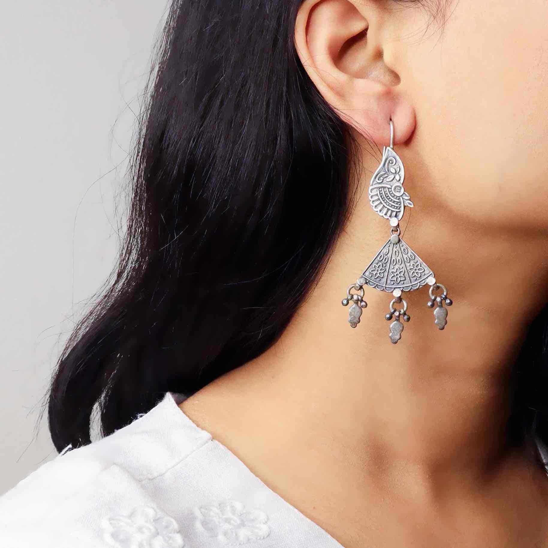 Elegant silver oxidized long earrings with intricate patterns and vintage-inspired charm