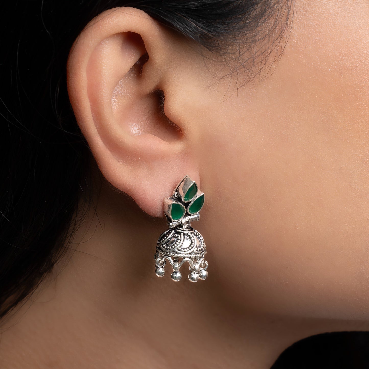 Intricately designed silver oxidized jhumka earrings with a traditional and vintage-inspired charm.